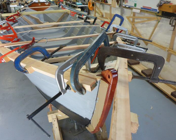 Gandelow_15-foot_Step-07-2_Steam-and-fit-gunwales_Starboard-clamps-at-stem-sheer-support